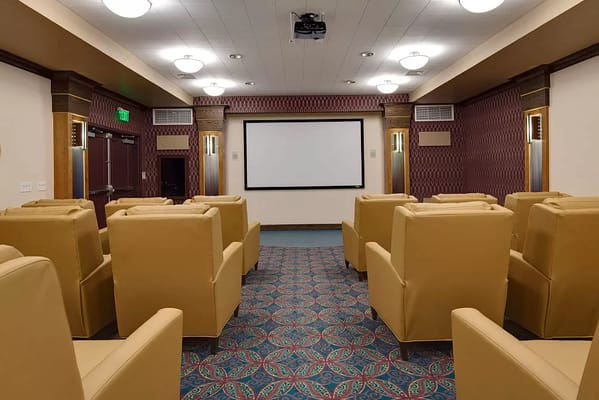 Interior of a cozy movie theater lounge with seating