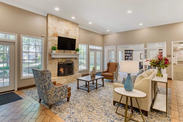 Spacious living room with a fireplace and comfortable seating.