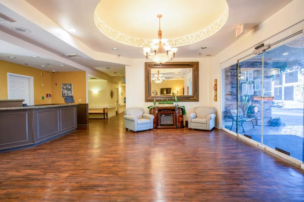 Spacious lobby area with seating and natural light