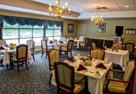 Dining room set with tables and chairs, elegantly decorated