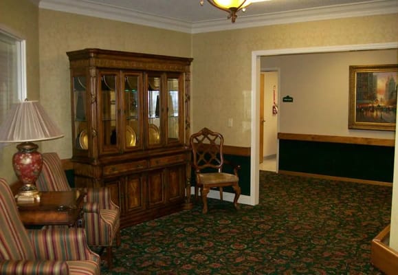 Cozy lobby with seating and display cabinet