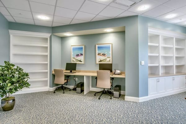 Bright interior office space with desks and artwork