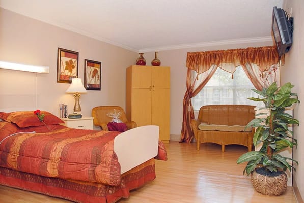 Cozy resident room with bed and seating area