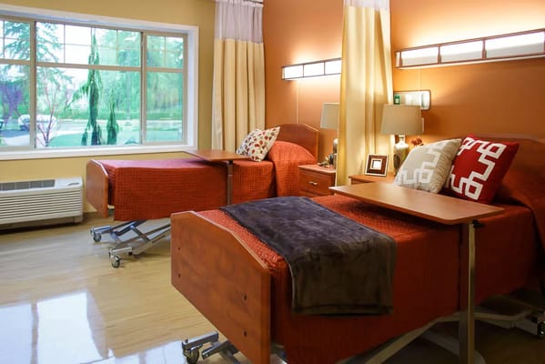 Bedroom with two adjustable beds and soft lighting