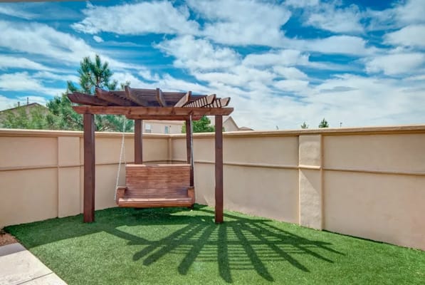 Outdoor swing in a serene garden setting