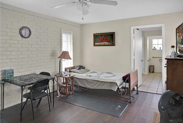 Private resident room with bed and small table