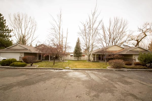 Exterior view of buildings with a grassy courtyard