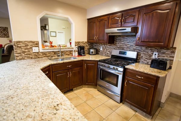 Bright, modern kitchen with granite countertops