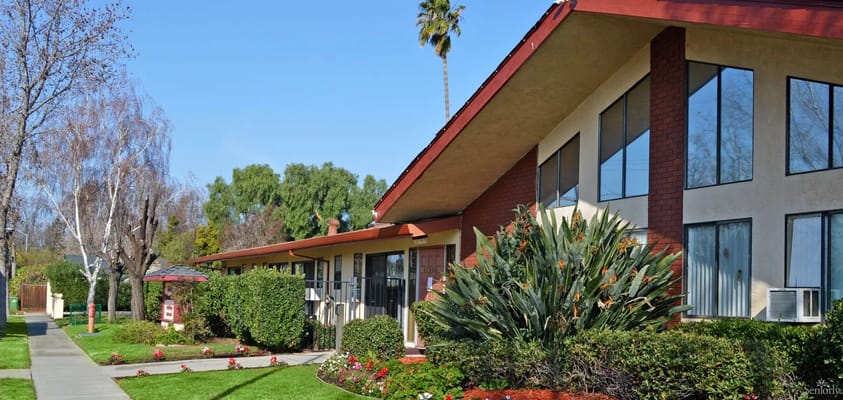 Exterior view of Lincoln Retirement Villa with landscaped pathways