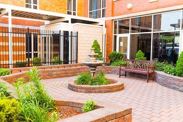 A serene courtyard with a fountain and seating