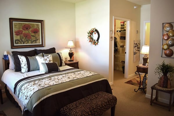 Cozy resident room with decor and a comfortable bed