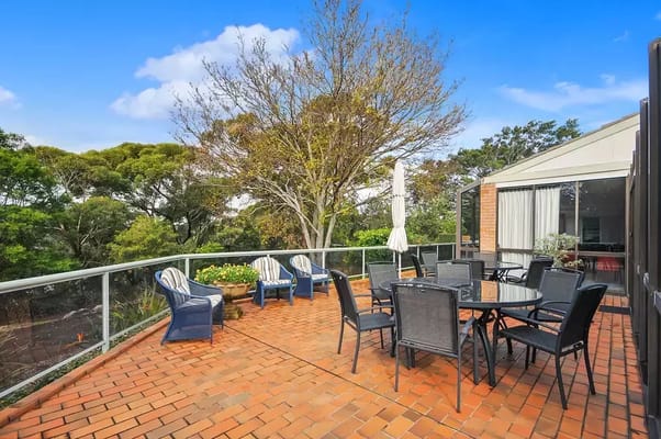 Outdoor patio area with seating and tables