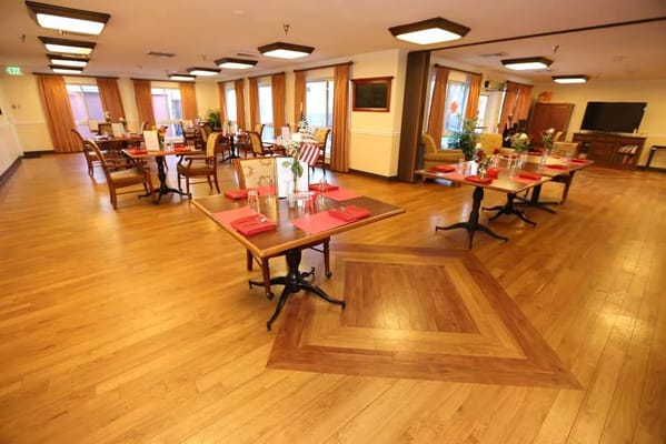 Dining room setup with tables and decorations