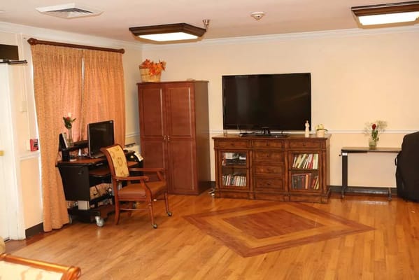 Interior view of a common area with furniture and TV