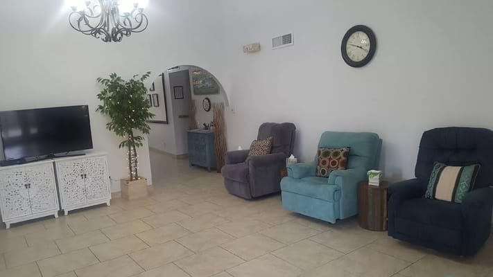 Common area with seating and decor in a bright interior