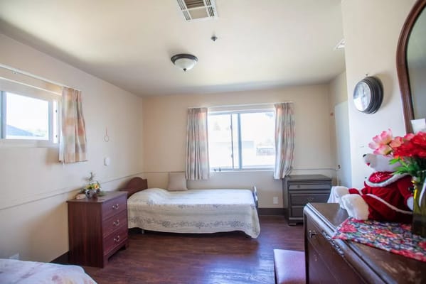 Bright private room with a bed and decorations