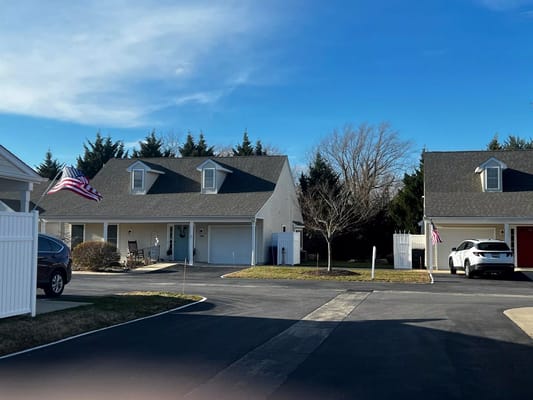 Exterior view of a senior living facility with flags