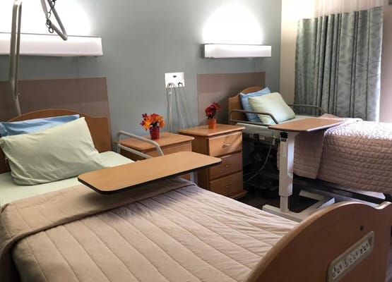 Interior view of two resident rooms with beds and furniture