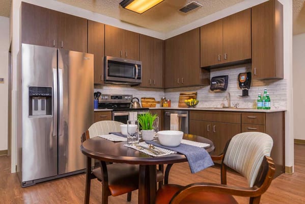 Dining table set with dishes in modern kitchen