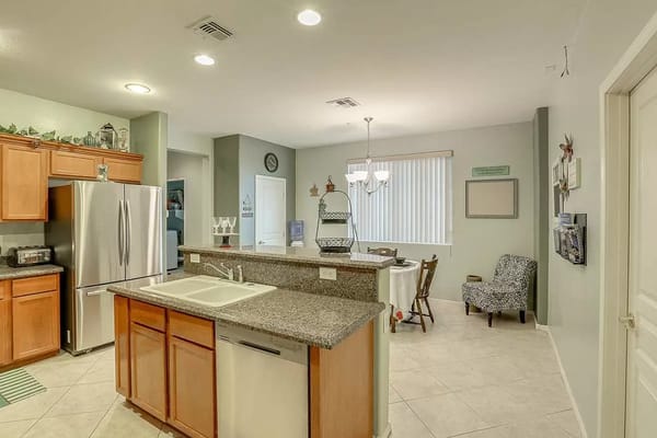 Modern kitchen with wooden cabinets and granite countertops