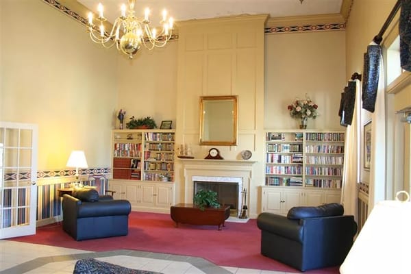 Cozy common area with bookshelves and seating