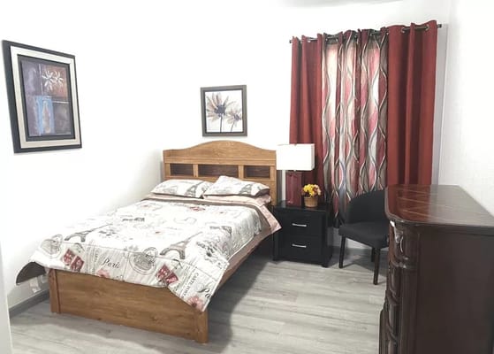 Cozy private resident room with bed and furnishings