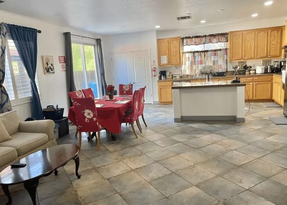 Bright common area with kitchen and dining space