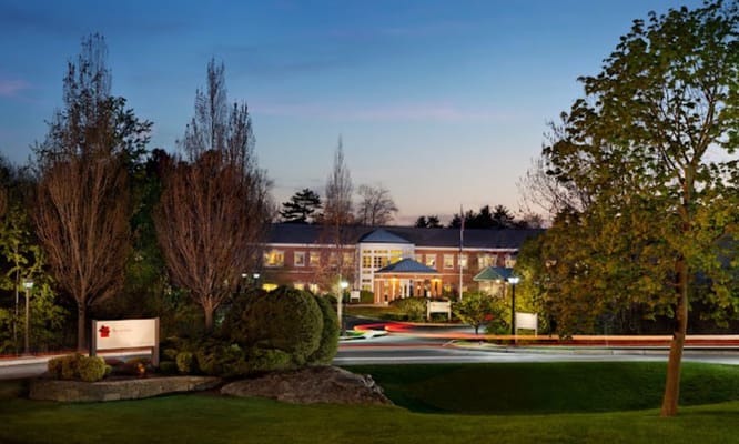 Exterior view of Lunder Memory Care at dusk