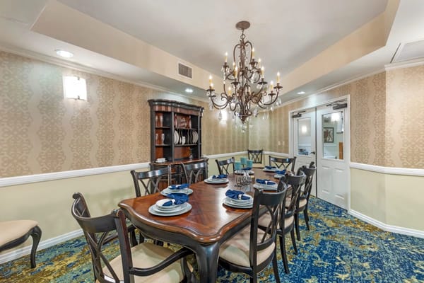 Elegant dining room with a chandelier and table setting