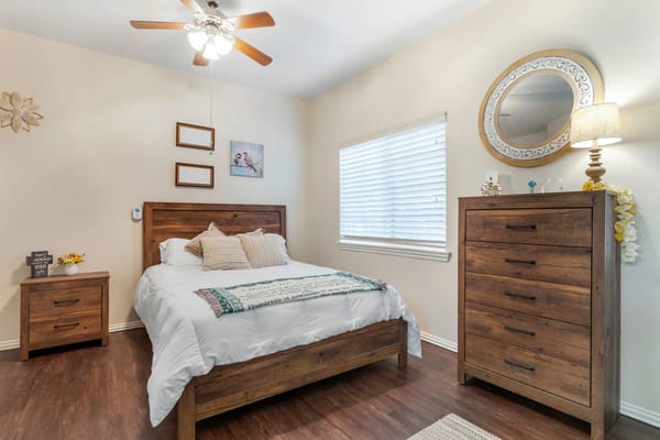 Cozy interior of a resident room with wooden furniture