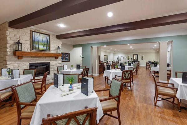 Bright dining area with tables set for meals