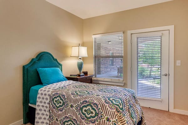 Cozy private resident room with a bed and window