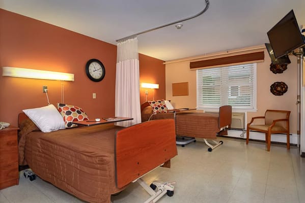 Interior view of a resident's room with two beds