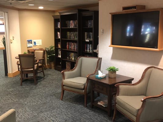 Interior common area with seating and bookshelves