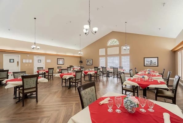 Dining area with neatly set tables and decor
