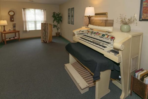 Interior view of a common area with an organ