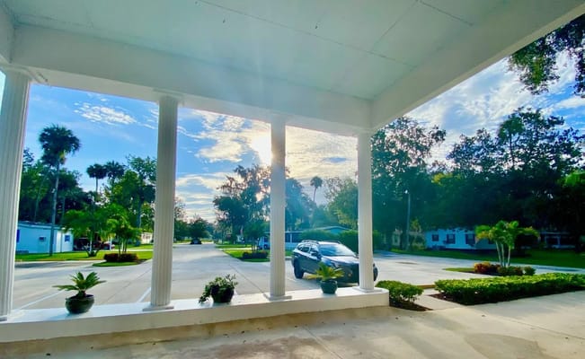 View of the facility's entrance with columns and landscaping