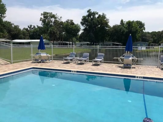 Outdoor swimming pool with lounge chairs