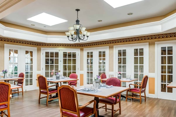 Dining area with tables and chairs in an interior setting