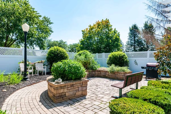 Beautiful outdoor garden area with seating and greenery