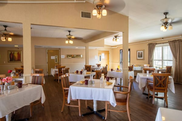 Dining room with tables set for meals