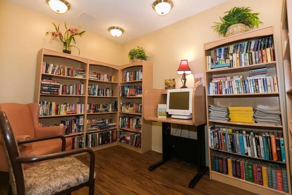 Cozy library area with bookshelves and a computer
