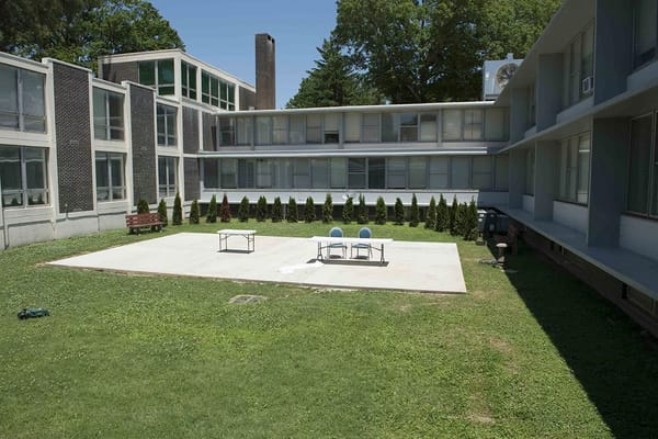Outdoor courtyard with seating and greenery