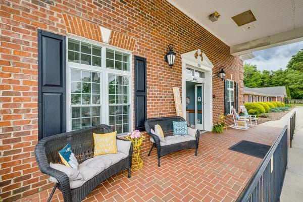Front entrance of Mallard Ridge with seating area
