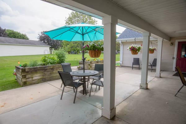 Outdoor seating area with tables and umbrellas