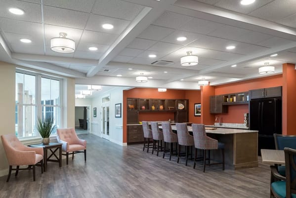 Bright common area with seating and bar area