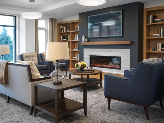 Cozy common area with seating and bookshelves
