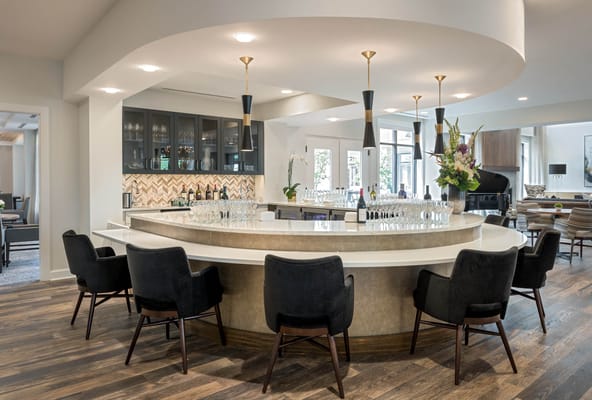 Stylish bar area with seating and modern decor