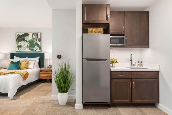 Showing a modern kitchenette in a resident's room