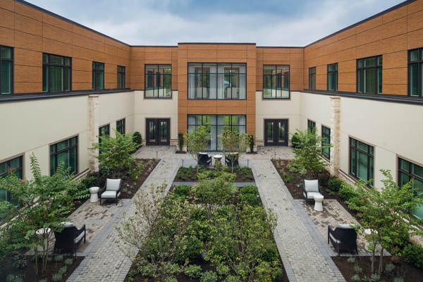 Courtyard garden with seating areas and greenery
